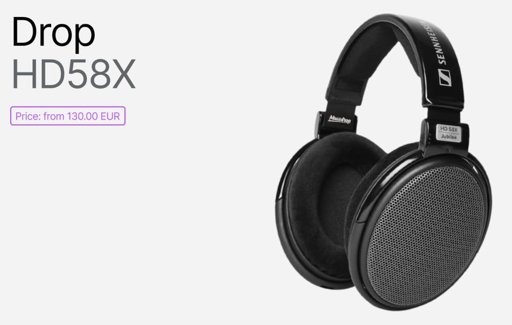 Drop HD58X Jubilee open-back headphones in black with a mesh grill, plush ear pads, and a reinforced headband, accompanied by price tag and large model name.