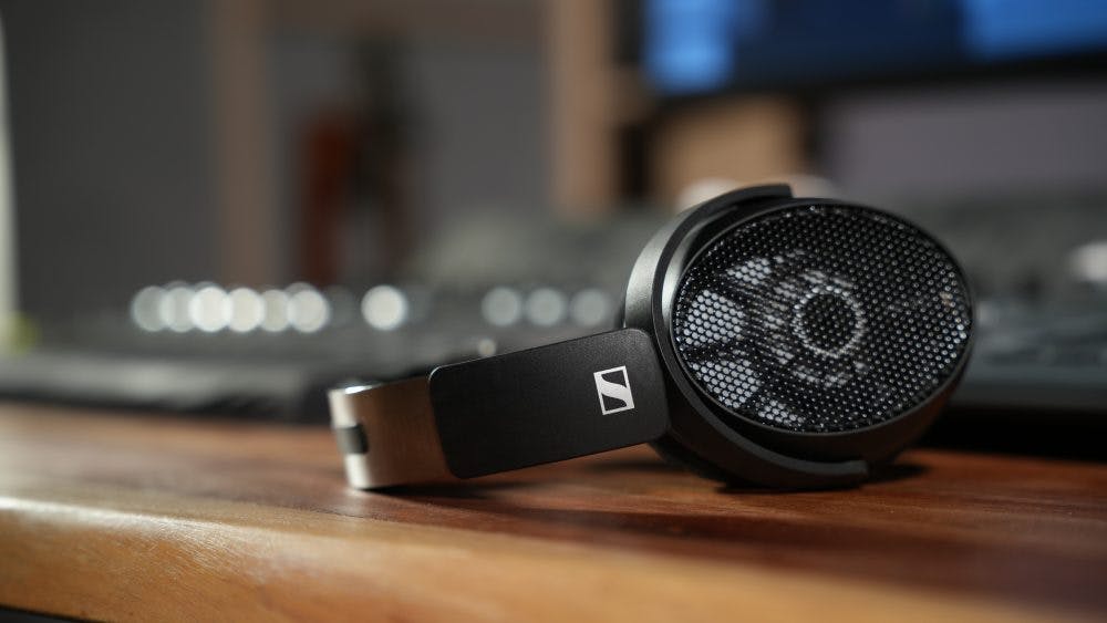 Sennheiser HD 490 Pro headphones on wooden desk with studio equipment background
