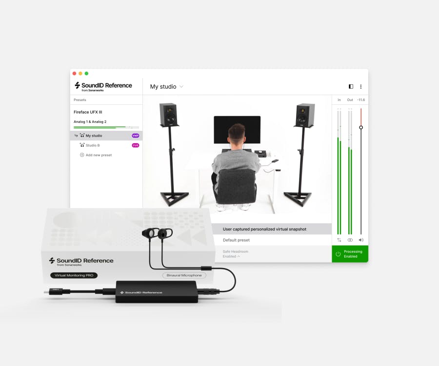 Person measuring studio sound using SoundID Reference Virtual Monitoring PRO software and in-ear binaural microphone, with speakers and computer setup in a recording studio environment.